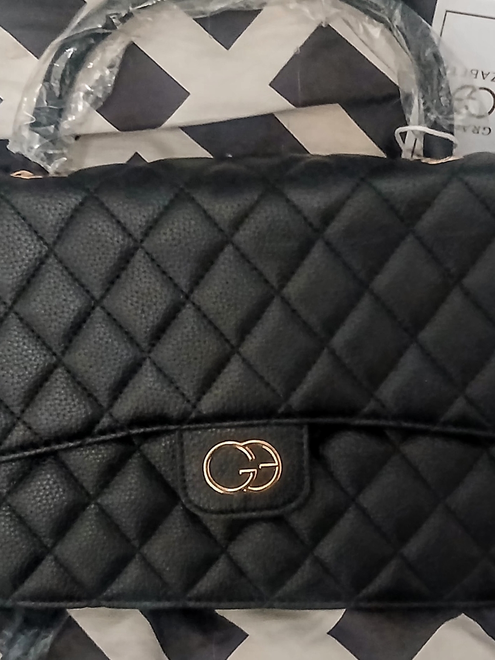 Quilted Black Shoulder Bag with Gold Double-Ring Accent